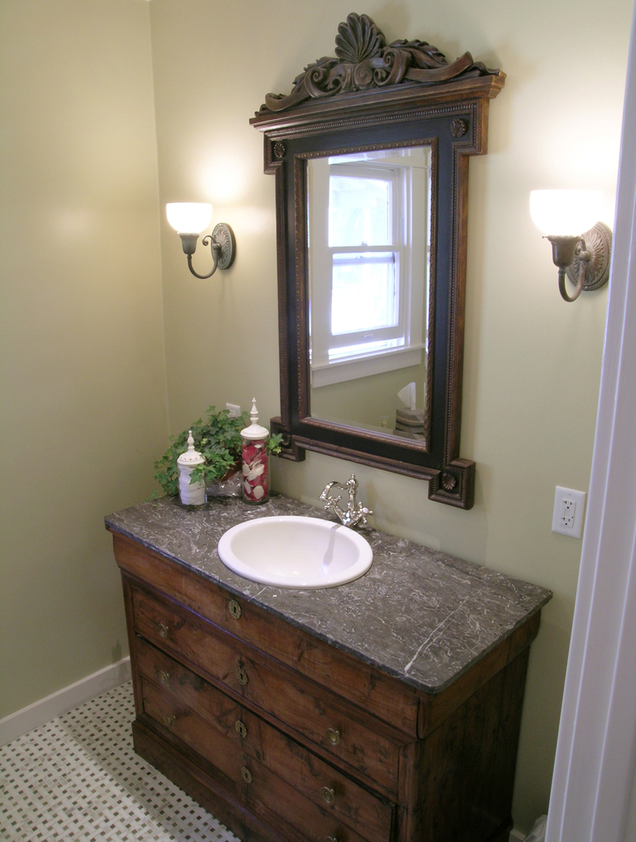 Guest bath with rustic sink and mirror Nott & Associates