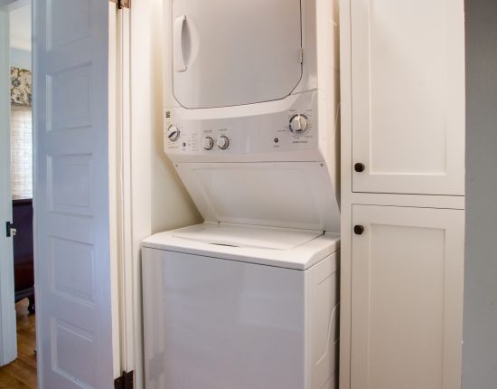 A 2nd floor laundry area with stackable washer/dryer.