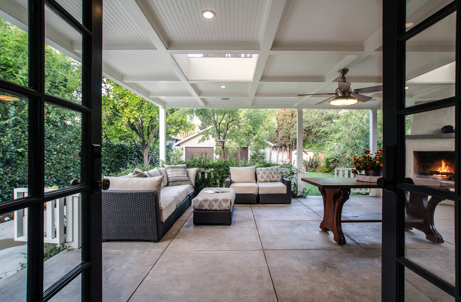 Outdoor living space with wood burning fireplace and BBQ