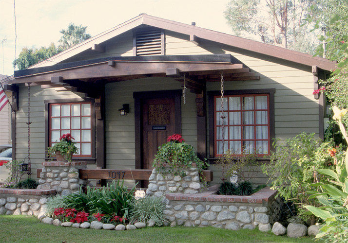 Restored with artistic landscaping and craftsman details.