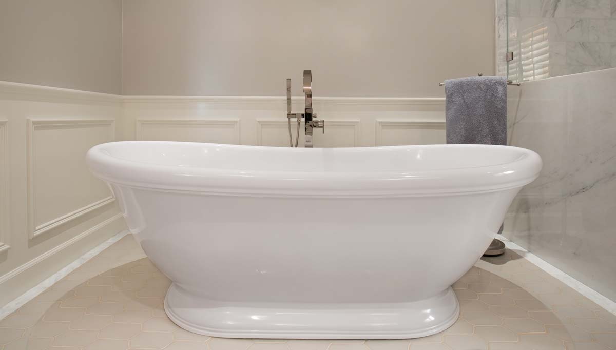 Soaking tub, custom wainscoting woodwork