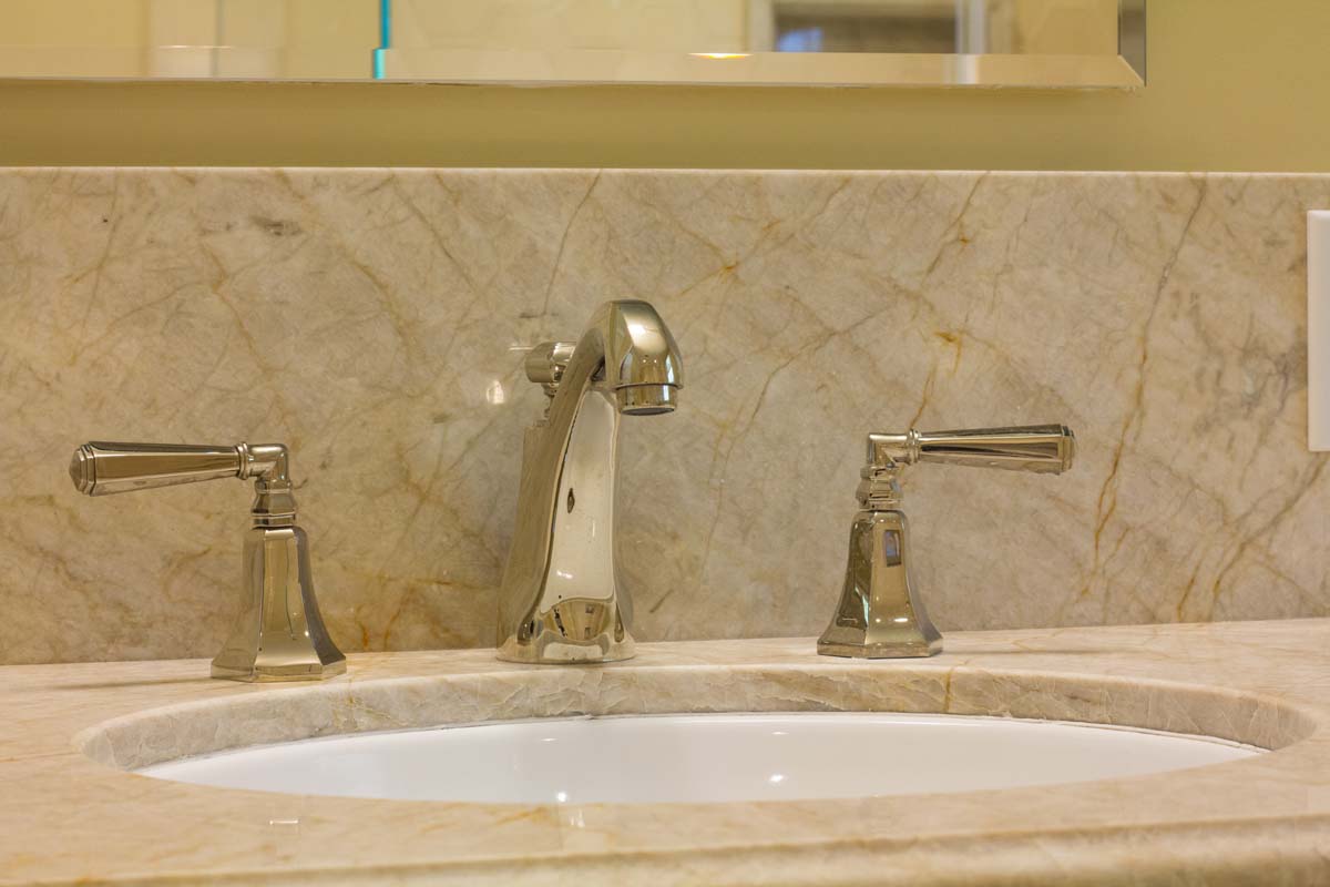 Polished nickel California faucets and Taj Mahal stone
