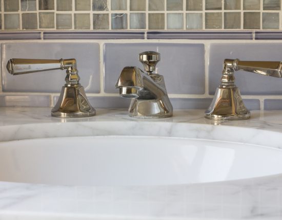 Polished nickel faucets and decorative tile