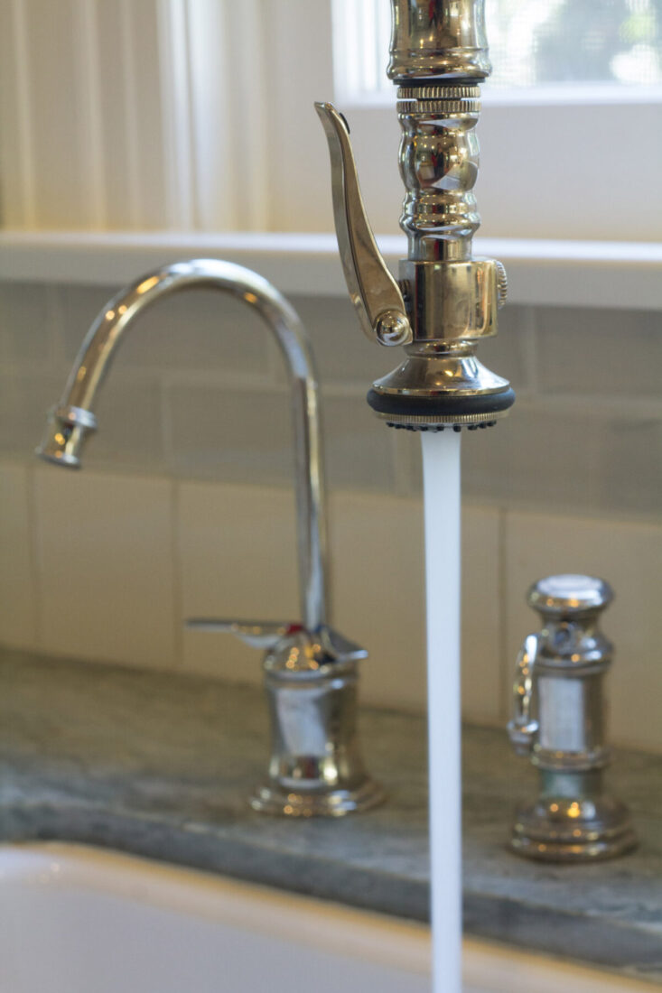 Polished nickel fixtures with water filter and Airswitch for garbage disposal