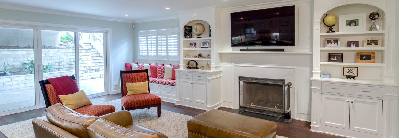 Built-in Bookcases in Living Room with Wood Details around Fireplace