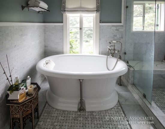 A soaking tub with window view