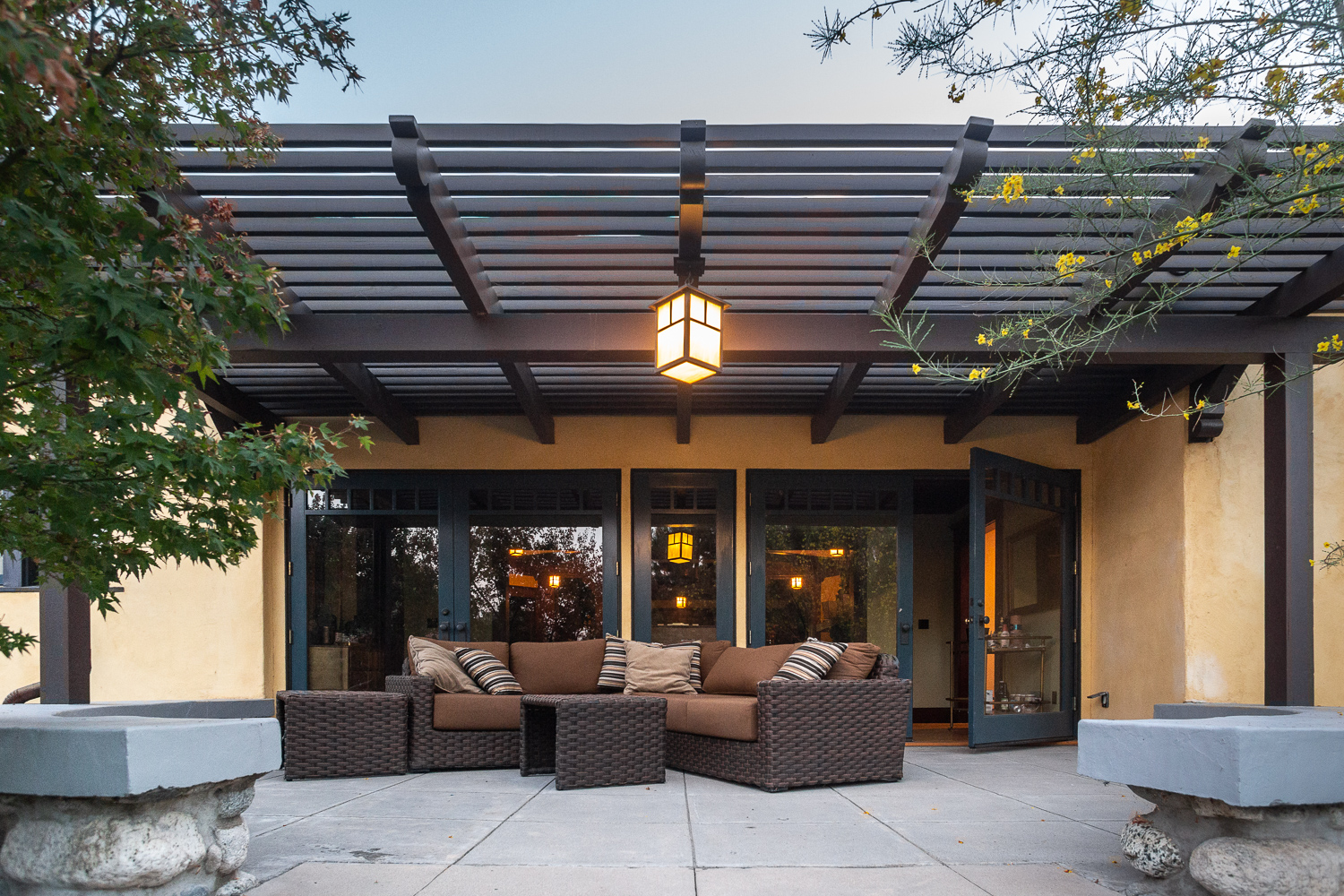 Backyard patio with custom lighting and outdoor furniture