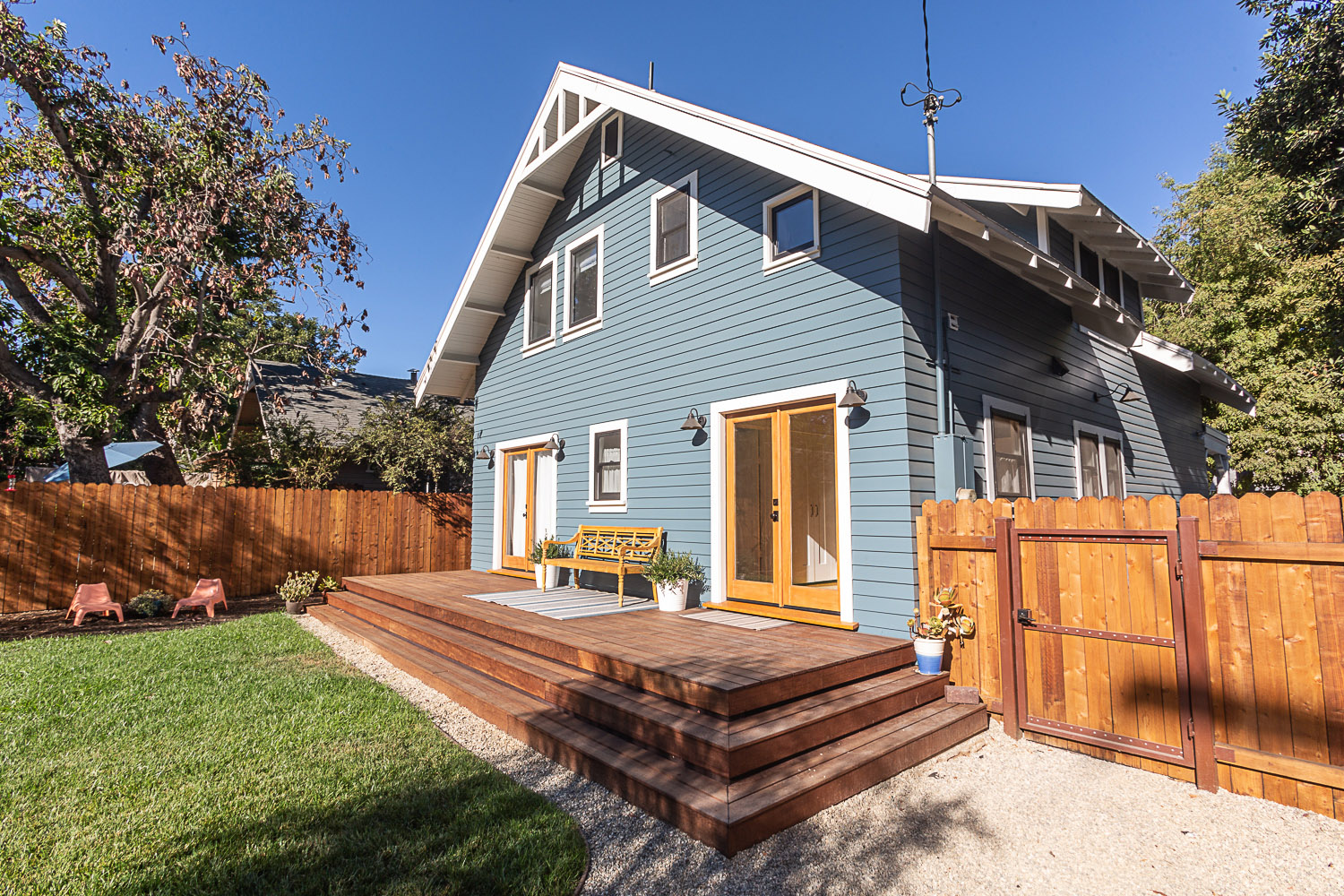 Mahogany deck of rebuilt Craftsman home.