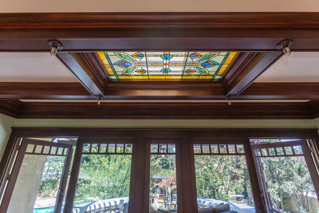 Stained glass skylight in historic home with integrated lights
