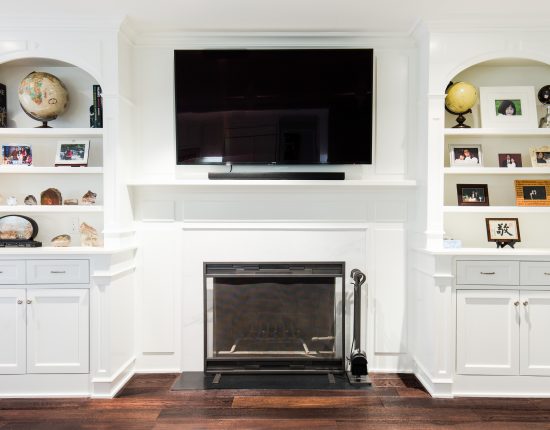 Custom Entertainment Center Over Fireplace With Flanking Bookcases