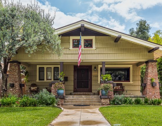 Restored Craftsman With Exposed Brick Columns And Accented Wood Work