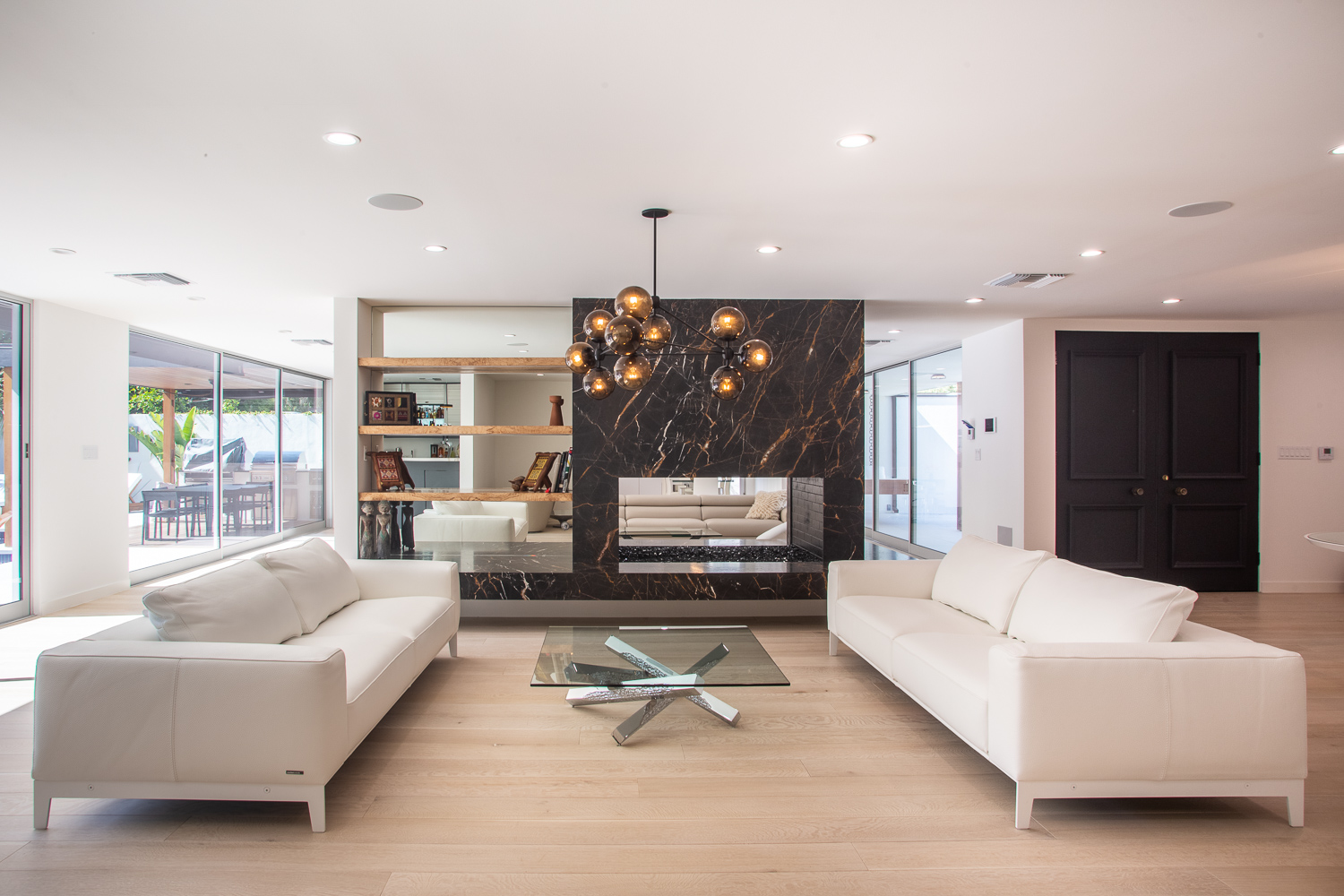 Open Shelving Next to Italian Marble Fireplace