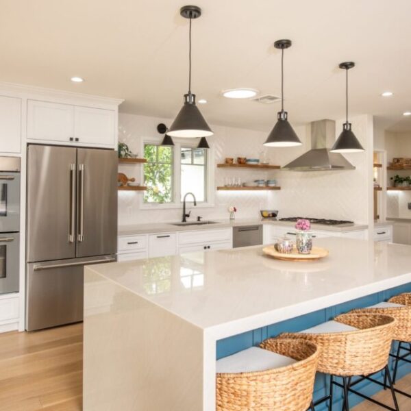 San Marino kitchen with marble island, hanging light fixtures, and luxury detailing.