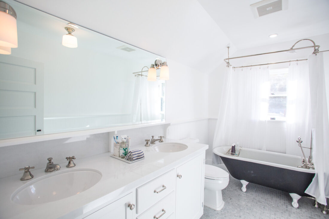 Double vanity bathroom remodel with tiled floors.