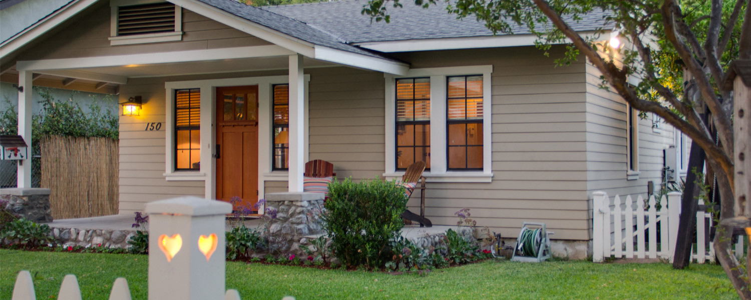 Restored craftsman exterior with custom details and a covered porch.