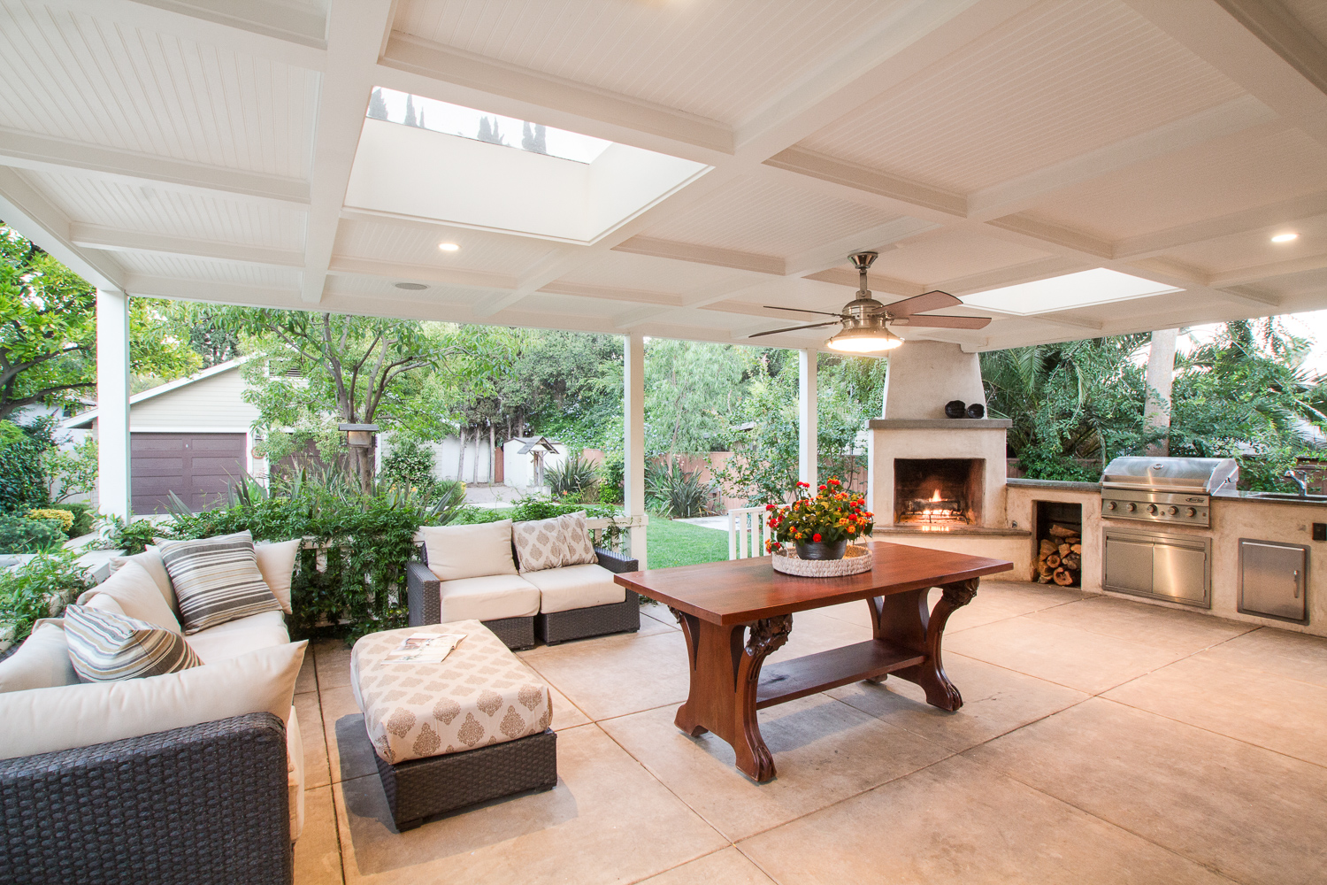 Outdoor living space with wood burning fireplace and BBQ